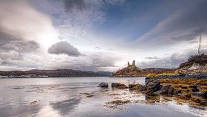 Preview wallpaper lake, coast, stones, sharp, cloudy