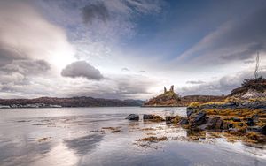 Preview wallpaper lake, coast, stones, sharp, cloudy