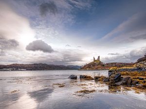 Preview wallpaper lake, coast, stones, sharp, cloudy