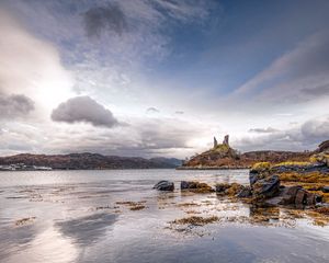 Preview wallpaper lake, coast, stones, sharp, cloudy