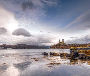 Preview wallpaper lake, coast, stones, sharp, cloudy