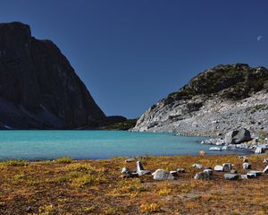 Preview wallpaper lake, coast, stones, azure, sky, moon, grass, faded