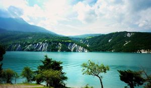 Preview wallpaper lake, coast, trees, bushes, azure, surface, clouds, sky, landscape