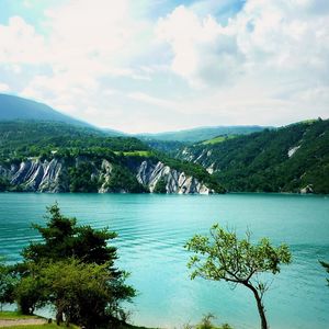 Preview wallpaper lake, coast, trees, bushes, azure, surface, clouds, sky, landscape