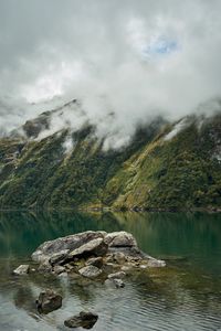 Preview wallpaper lake, fog, rocks, mountain, stone, new zealand