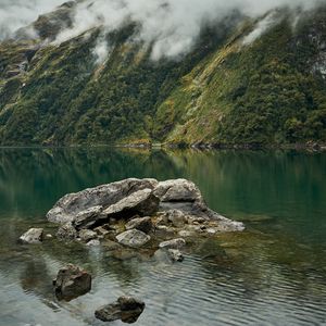 Preview wallpaper lake, fog, rocks, mountain, stone, new zealand