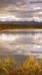 Preview wallpaper lake, grass, cloudy, bad weather, despondency, mountains