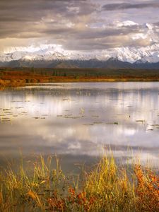 Preview wallpaper lake, grass, cloudy, bad weather, despondency, mountains