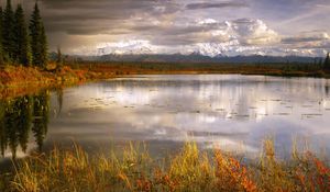 Preview wallpaper lake, grass, cloudy, bad weather, despondency, mountains