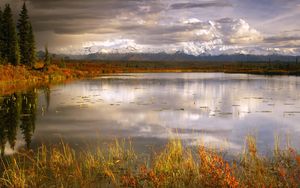 Preview wallpaper lake, grass, cloudy, bad weather, despondency, mountains