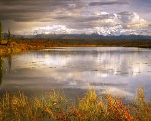 Preview wallpaper lake, grass, cloudy, bad weather, despondency, mountains