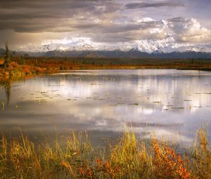 Preview wallpaper lake, grass, cloudy, bad weather, despondency, mountains