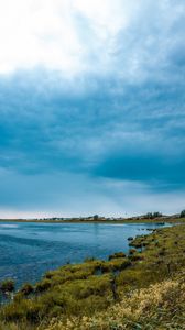 Preview wallpaper lake, grass, shore, horizon, clouds, sky