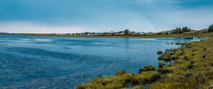 Preview wallpaper lake, grass, shore, horizon, clouds, sky
