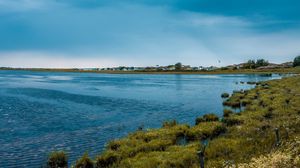 Preview wallpaper lake, grass, shore, horizon, clouds, sky