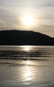 Preview wallpaper lake, hill, silhouette, sun, evening