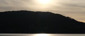 Preview wallpaper lake, hill, silhouette, sun, evening