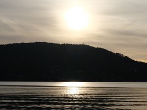 Preview wallpaper lake, hill, silhouette, sun, evening