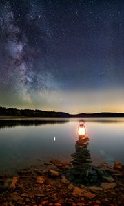 Preview wallpaper lake, lantern, night, shore, stones