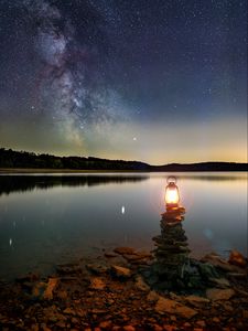 Preview wallpaper lake, lantern, night, shore, stones