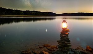 Preview wallpaper lake, lantern, night, shore, stones