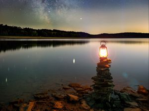 Preview wallpaper lake, lantern, night, shore, stones