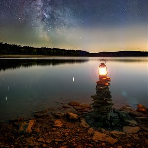 Preview wallpaper lake, lantern, night, shore, stones