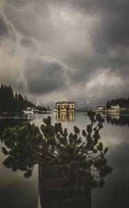 Preview wallpaper lake, lightning, thunderstorm, mountains, buildings