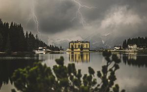 Preview wallpaper lake, lightning, thunderstorm, mountains, buildings