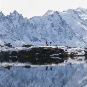 Preview wallpaper lake, mountain, snow, people, travel, nature