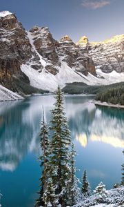 Preview wallpaper lake, mountain tops, fir-trees, water table
