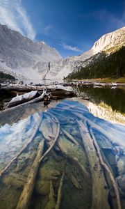 Preview wallpaper lake, mountain, water, logs, landscape