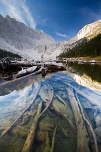 Preview wallpaper lake, mountain, water, logs, landscape