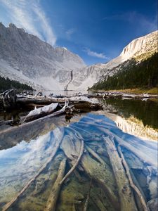 Preview wallpaper lake, mountain, water, logs, landscape
