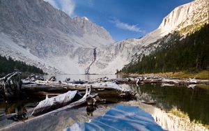 Preview wallpaper lake, mountain, water, logs, landscape