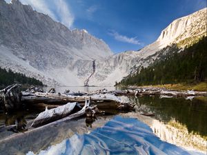 Preview wallpaper lake, mountain, water, logs, landscape