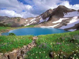 Preview wallpaper lake, mountains, alpes, greens, national park, blue water, stones