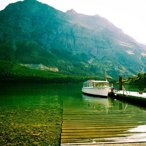 Preview wallpaper lake, mountains, bottom, transparent, water, boat, walking