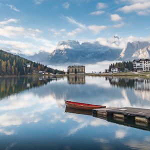 Preview wallpaper lake, mountains, buildings, pier, boat, landscape