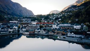 Preview wallpaper lake, mountains, buildings, city, aerial view