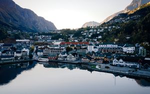 Preview wallpaper lake, mountains, buildings, city, aerial view