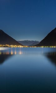 Preview wallpaper lake, mountains, city, lights, night, reflection
