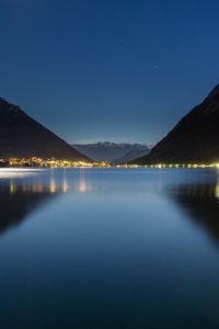 Preview wallpaper lake, mountains, city, lights, night, reflection