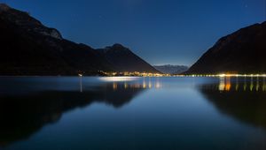 Preview wallpaper lake, mountains, city, lights, night, reflection