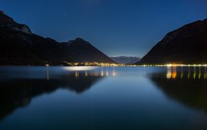 Preview wallpaper lake, mountains, city, lights, night, reflection