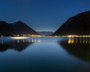 Preview wallpaper lake, mountains, city, lights, night, reflection