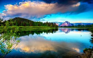 Preview wallpaper lake, mountains, clouds, sky, brightly, water smooth surface, contrast