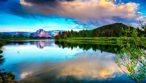 Preview wallpaper lake, mountains, clouds, smooth surface, reflection, sky, brightly, branches