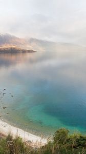 Preview wallpaper lake, mountains, coast, rainbow, after a rain