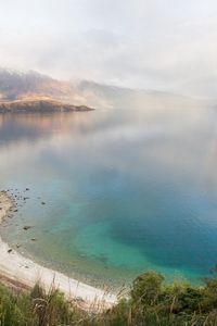 Preview wallpaper lake, mountains, coast, rainbow, after a rain